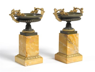 Lot 1322 - A Pair of French Parcel Gilt Bronze Campana Urns, circa 1830, of melon fluted form with...