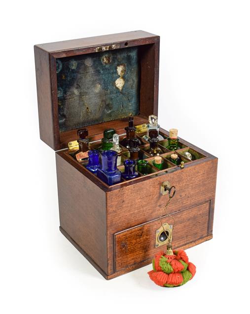 Lot 3089 - Apothecary Chest mahogany case with top section containing 15 assorted bottles and lower drawer...