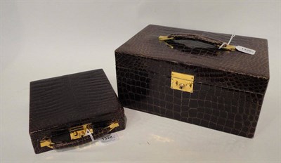 Lot 1328 - An Asprey's Crocodile Skin Vanity Case, of rectangular form with strap handle, the hinged cover...