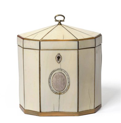 Lot 1329 - A George III Tortoiseshell and Silver Mounted Ivory Tea Caddy, of panelled oval form with loop...