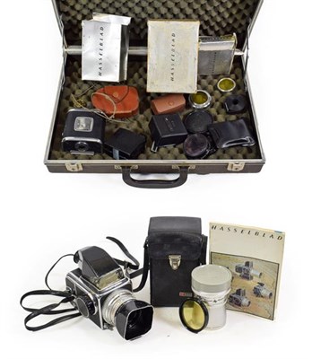 Lot 3115 - Hassleblad 500C/M Outfit consisting of body no.UH131019 with prism viewer and two film back;...
