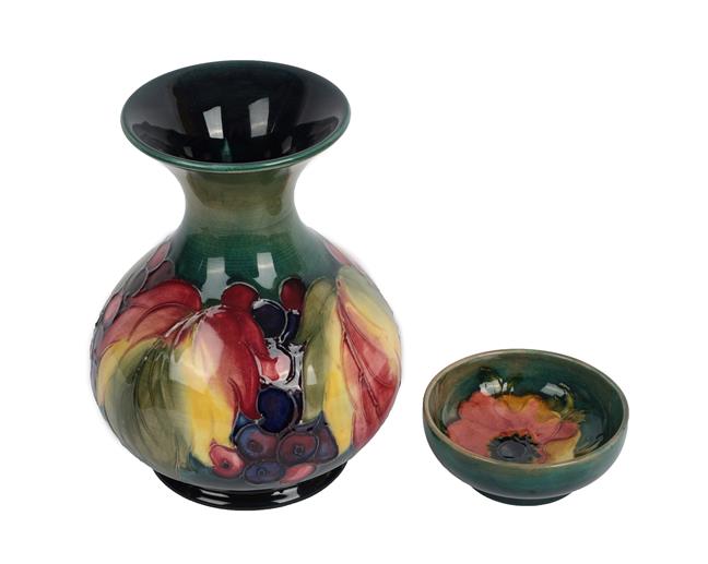 Lot 1001 - Walter Moorcroft (1917-2002): A Leaf and Grape Pattern Vase, impressed factory marks and blue...