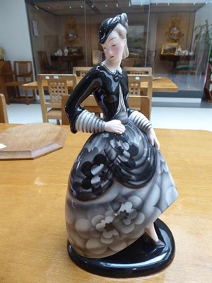 Lot 1021 - An Art Deco Goldscheider Pottery Figure, by Claire Weiss, modelled as a woman wearing a floral...