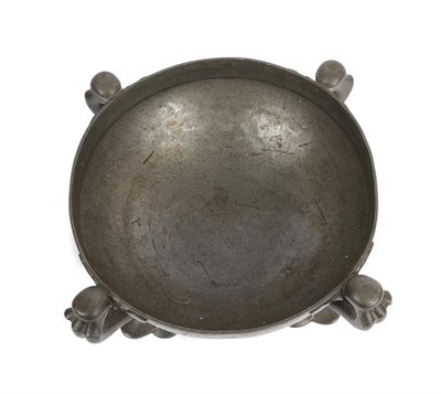Lot 1030 - Oliver Baker for Liberty & Co: A Tudric Pewter Bowl, model 067, the hammered bowl on four...