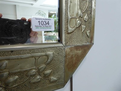 Lot 1034 - A Scottish Arts & Crafts Rectangular Patinated Metal Mirror, bevelled plate within repoussé...
