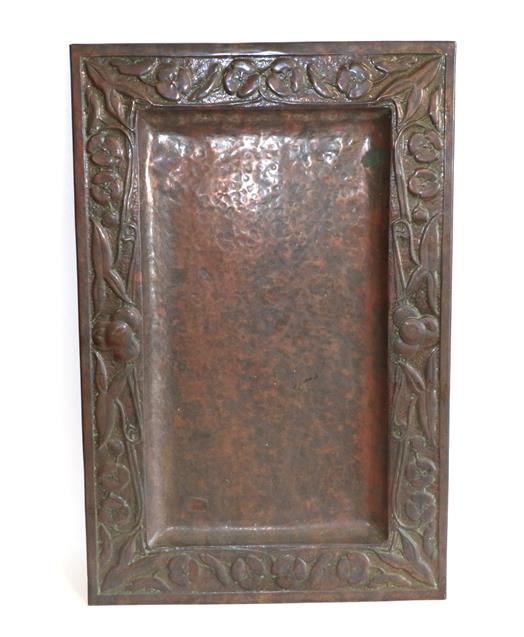 Lot 1035 - A Scottish Arts & Crafts Rectangular Copper Tray, repoussé decorated with flower heads and...
