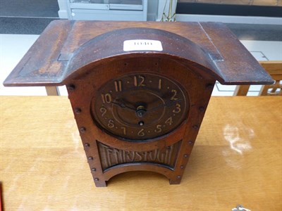 Lot 1040 - An Arts & Crafts Oak and Copper Mantel Clock, domed top, oak rivets, the hammered dial with...