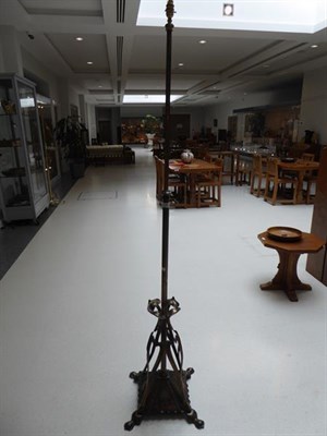 Lot 1044 - An Art Nouveau Lacquered Copper Telescopic Standard Lamp, c.1910, on four supports, weighted...