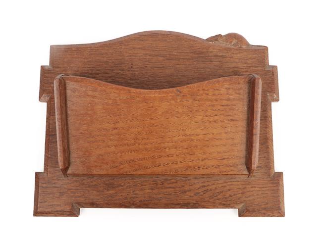 Lot 1047 - Robert Mouseman Thompson (1876-1955): An English Oak Wall Mounted Letter Rack, probably made by Len