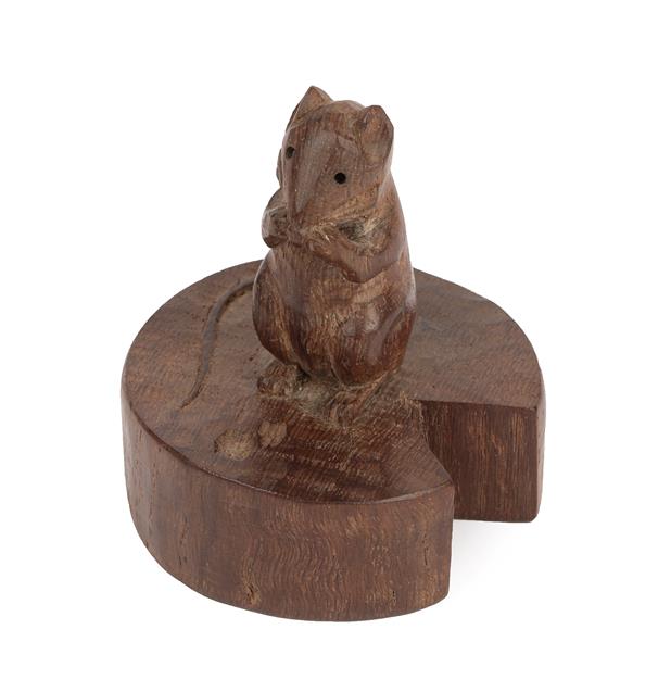 Lot 1048 - Robert Mouseman Thompson (1876-1955): An English Oak Mouse on a Wedge, the mouse carved on it's...