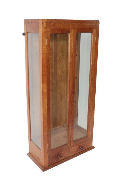 Lot 1053 - Robert Mouseman Thompson (1876-1955): An English Oak Gun Cabinet Display Cupboard, c.1950's,...