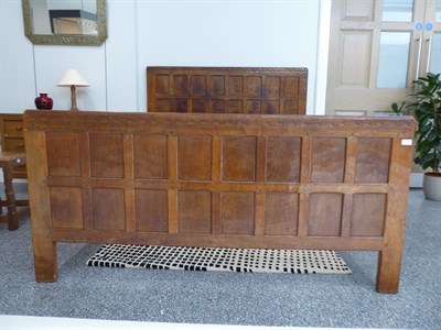 Lot 1054 - Robert Mouseman Thompson (1876-1955): An English Oak 5ft Panelled Bedstead, penny moulded top, with
