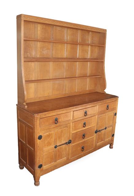 Lot 1055 - Workshop of Robert Mouseman Thompson (Kilburn): An English Oak Panelled 5ft Welsh Dresser, the open
