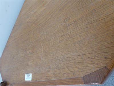 Lot 1065 - Workshop of Robert Mouseman Thompson (Kilburn): An English Oak Hanging Corner Cupboard, with...