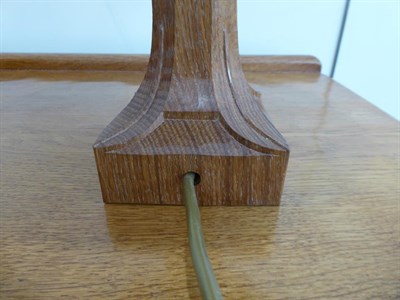 Lot 1079 - Workshop of Robert Mouseman Thompson (Kilburn): An English Oak Table Lamp, octagonal column on...