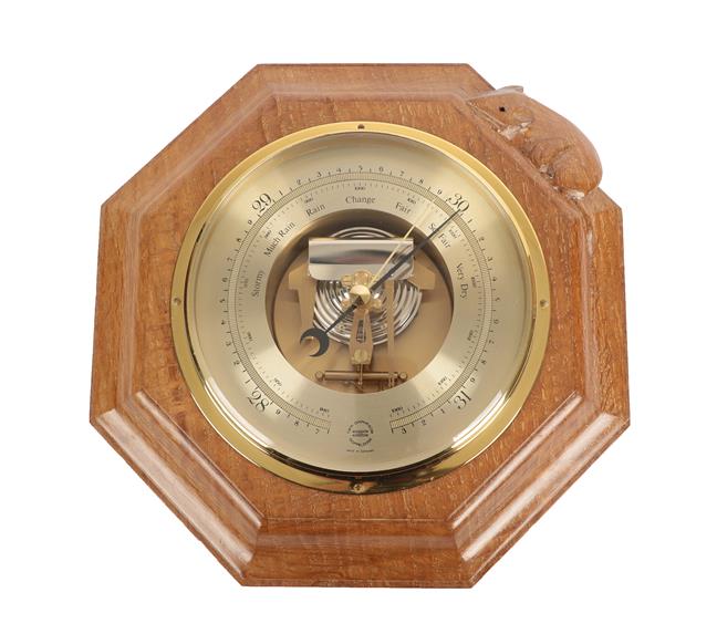 Lot 1081 - Workshop of Robert Mouseman Thompson (Kilburn): An English Oak Barometer, the octagonal frame...