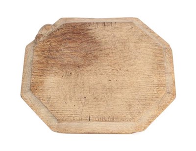 Lot 1137 - Workshop of Robert Mouseman Thompson (Kilburn): An English Oak Bread Board, of canted...