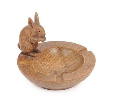Lot 1177 - Stan Dodds (1928-2012): An English Oak Ashtray, the circular tray with early carved rabbit...