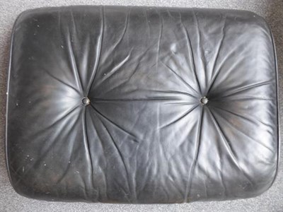 Lot 1185 - Charles and Ray Eames: A Brazilian Rosewood Lounge Chair and Ottoman, 1970s, the black leather...