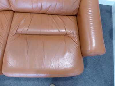 Lot 1187 - A Tetrad Brown Leather Sofa and Armchair, on brown castors, both labelled tetrad ENGLAND MAKERS...