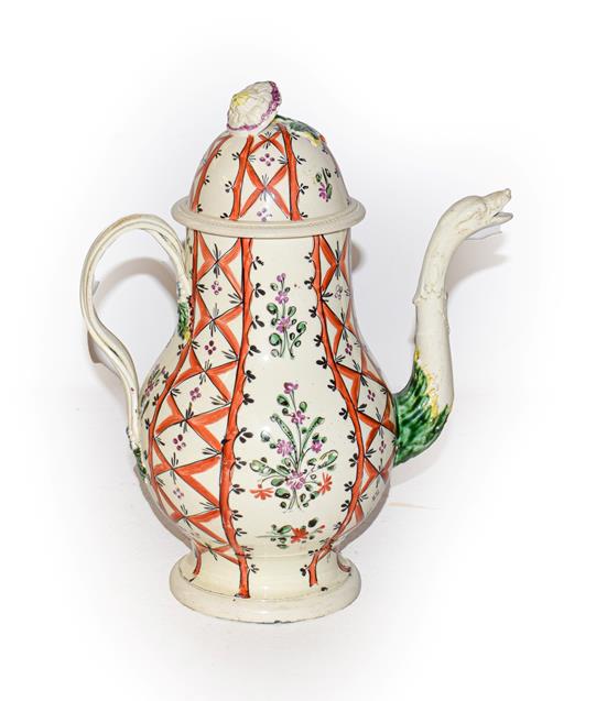 Lot 32 - A late 18th century Leeds Creamware coffee pot and cover, with floral finial, the spout moulded...