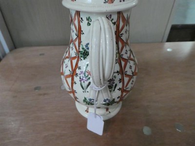 Lot 32 - A late 18th century Leeds Creamware coffee pot and cover, with floral finial, the spout moulded...