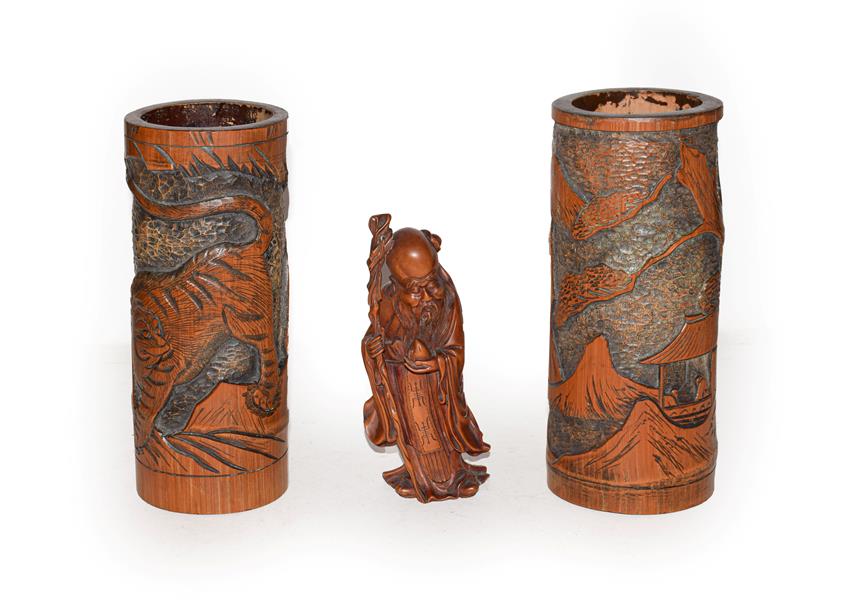 Lot 41 - Chinese boxwood figure of Shao Lao together with a pair of Japanese bamboo brush pots (3)