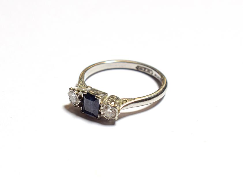 Lot 67 - A sapphire and diamond three stone ring, stamped 'PLATINUM', finger size M1/2