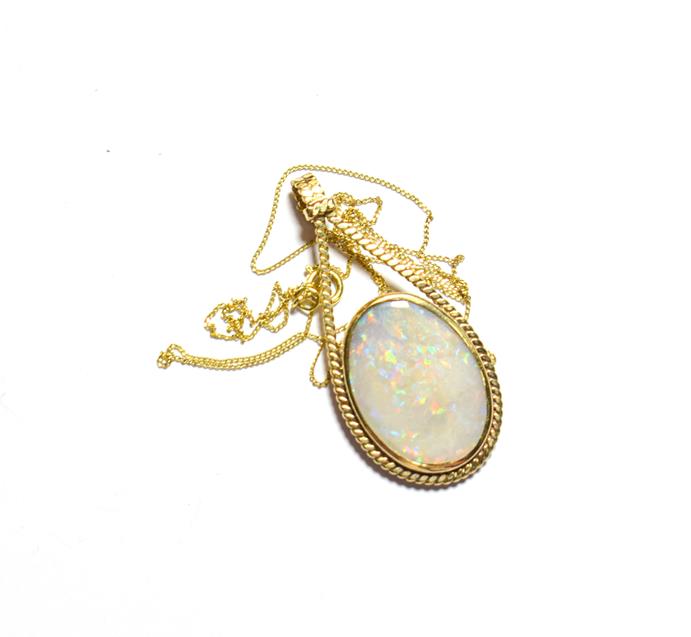 Lot 81 - A 9 carat gold opal pendant on a fine trace link chain, pendant length 3.9cm, chain length 45.5cm