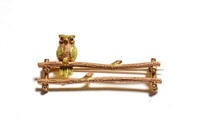 Lot 101 - A brooch, depicting an owl perched on a branch, stamped '9CT', length 4.0cm