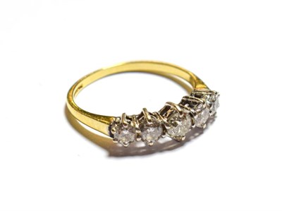 Lot 104 - An 18 carat gold diamond five stone ring, the graduated round brilliant cut diamonds in white...