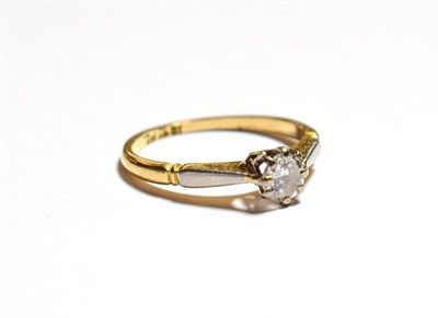Lot 129 - A diamond solitaire ring, the round brilliant cut diamond in a white claw setting, to a yellow...