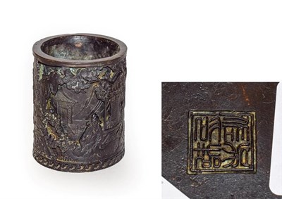 Lot 142 - A 20th century Chinese bronze bitong/brush pot, decorated in relief figures in a village landscape