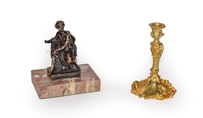 Lot 143 - A gilt bronze taperstick in rococo style, 11cm, together with a cast brass figure of a...