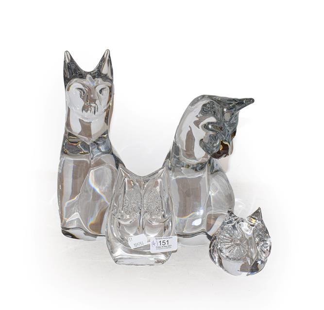 Lot 151 - Daum, France, a crystal seated cat 22.5cm, a crystal seated cat 27.5cm, two crystal owls, one...