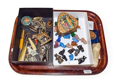 Lot 157 - A tray of various items including an alabastor sphinx , various coloured glass charms in animal...