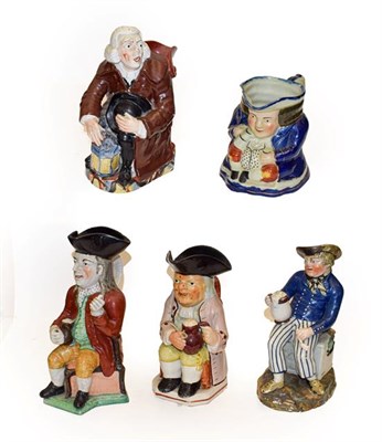 Lot 168 - A quantity of 19th century Staffordshire Toby jugs including thin man type, Ralph Wood type and...