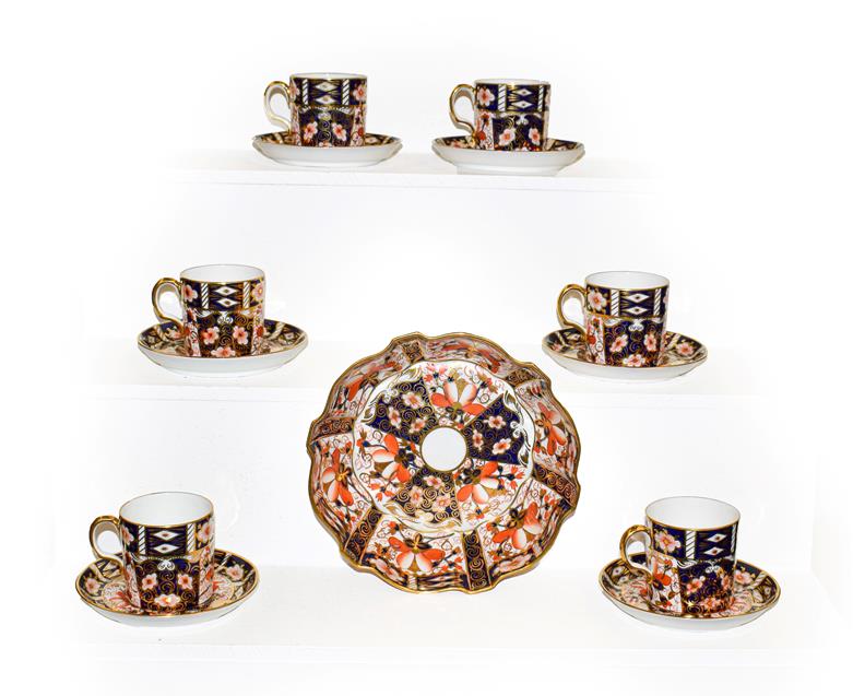 Lot 171 - A set of six Royal Crown Derby Imari coffee cans and saucers and a matching bowl