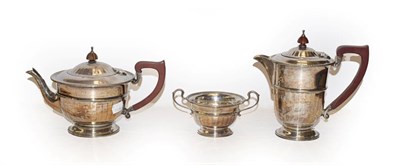 Lot 181 - A silver three-piece tea service with wooden handles, by Adie Brothers Ltd, Birmingham, 1941, gross