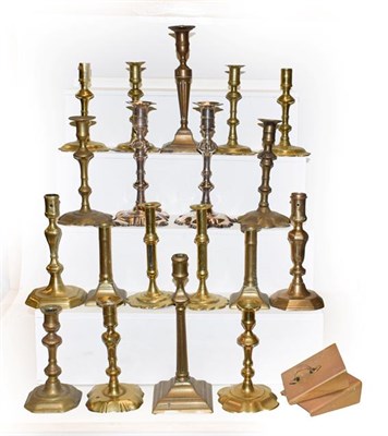 Lot 184 - A quantity of 18th century and later brass candlesticks, mostly pairs together with two silver...