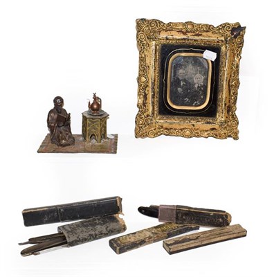Lot 193 - A cold painted bronze figural inkwell of moresque gentleman reading, together with Victorian framed