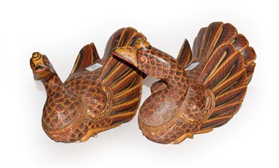 Lot 210 - A pair of Oriental carved hardwood and polychrome models of ducks with gilt decoration, 30cm
