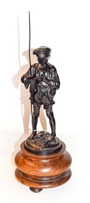 Lot 253 - A Russian patented cast iron figure of a fisher boy on an oak pedestal