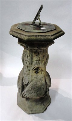 Lot 1388 - A Sandstone Sundial Pedestal, 19th century, of octagonal form carved with swans and foliage on...