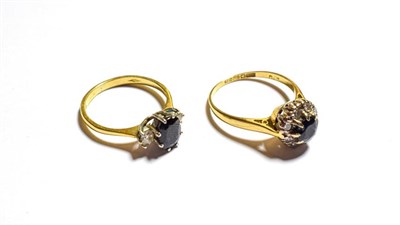 Lot 267 - An 18 carat gold sapphire and diamond cluster ring, finger size M and an 18 carat gold sapphire and