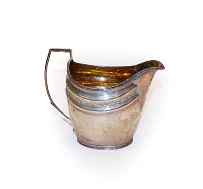 Lot 292 - A George III silver cream jug, by Peter, Ann and William Bateman, London, 1802, helmet shaped...