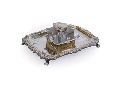 Lot 302 - A George V silver inkstand, by Barker Brothers, Chester, 1910, oblong and on four cast paw...