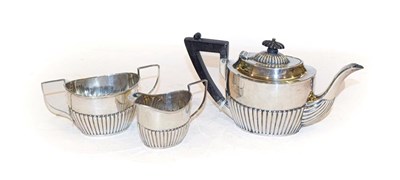 Lot 308 - A three piece Victorian silver bachelor's tea service, by Maurice Baum, Sheffield, 1898, each piece