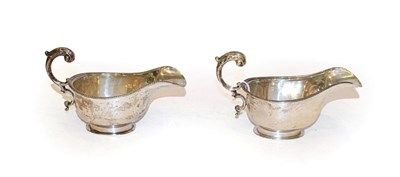 Lot 317 - A pair of George V silver sauce boats, by S Blanckensee and Son Ltd., Birmingham, 1935, oval...