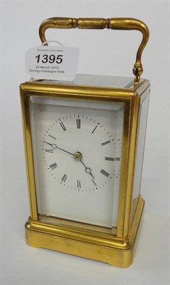 Lot 1395 - A Brass Striking Carriage Clock, circa 1880, with carrying handle and bevelled glass panels,...